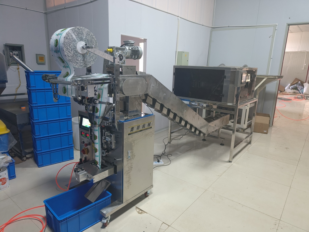 涼皮面筋塊自動(dòng)包裝機(jī)工作原理和性能分析